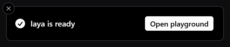 A toast reading laya is ready, with an Open playground button, dark mode